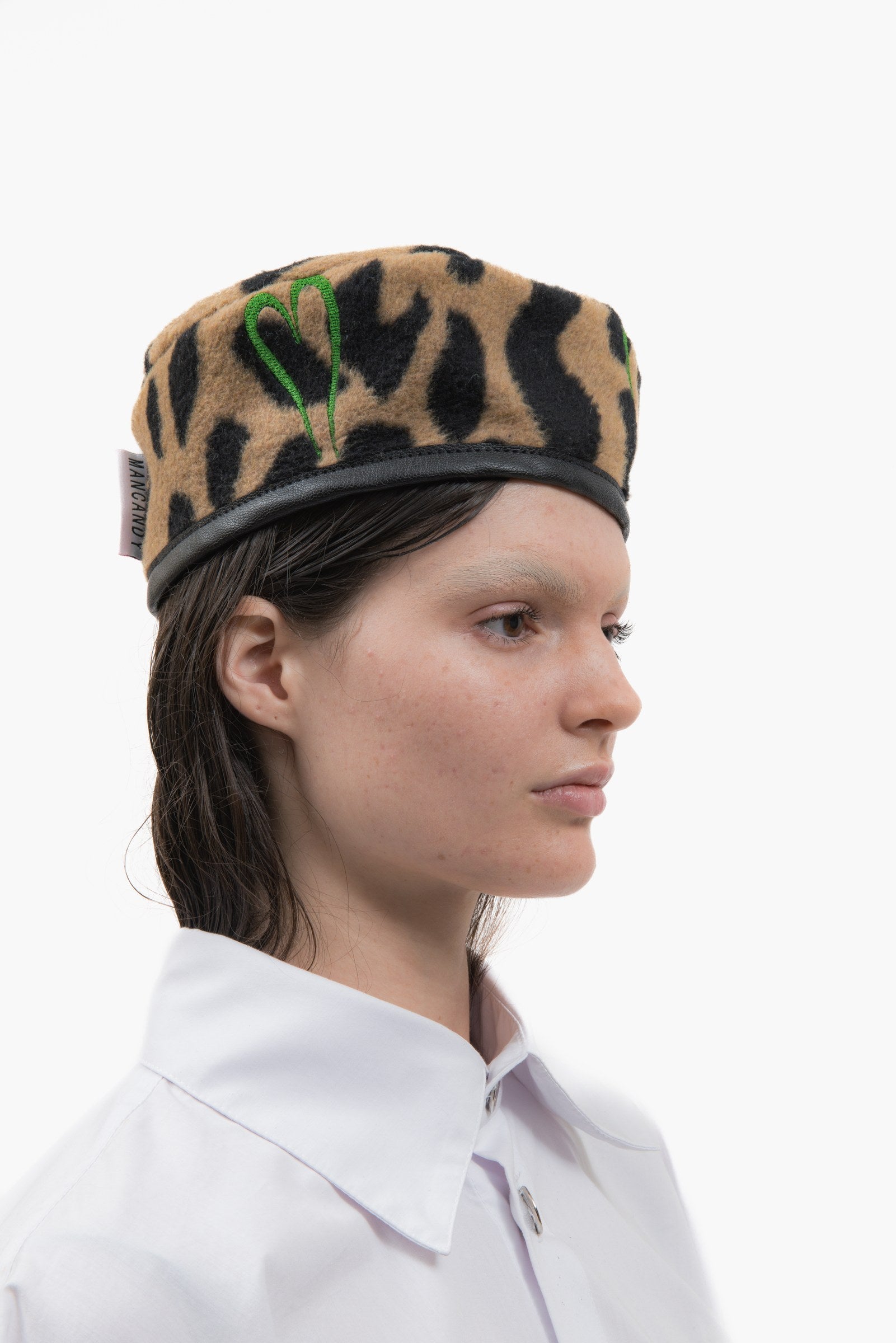 Right three-quarter view of the Officer Cap in leopard wool felt.