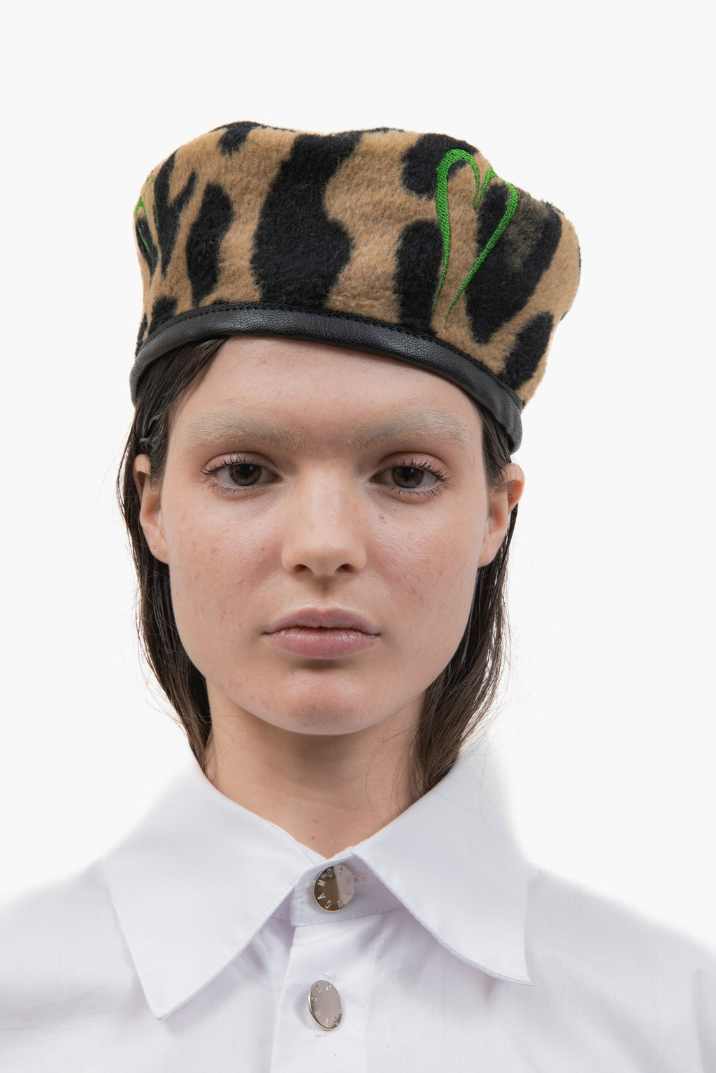 Officer Cap in leopard wool felt with embroidered heart detailing, front view.
