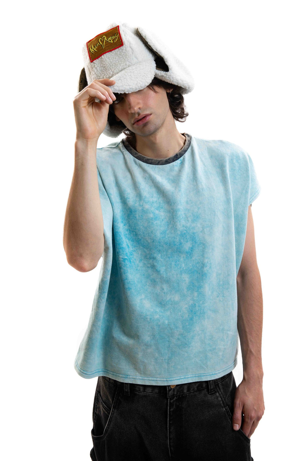 Off Duty Hat in white faux shearling shown frontally on a male model