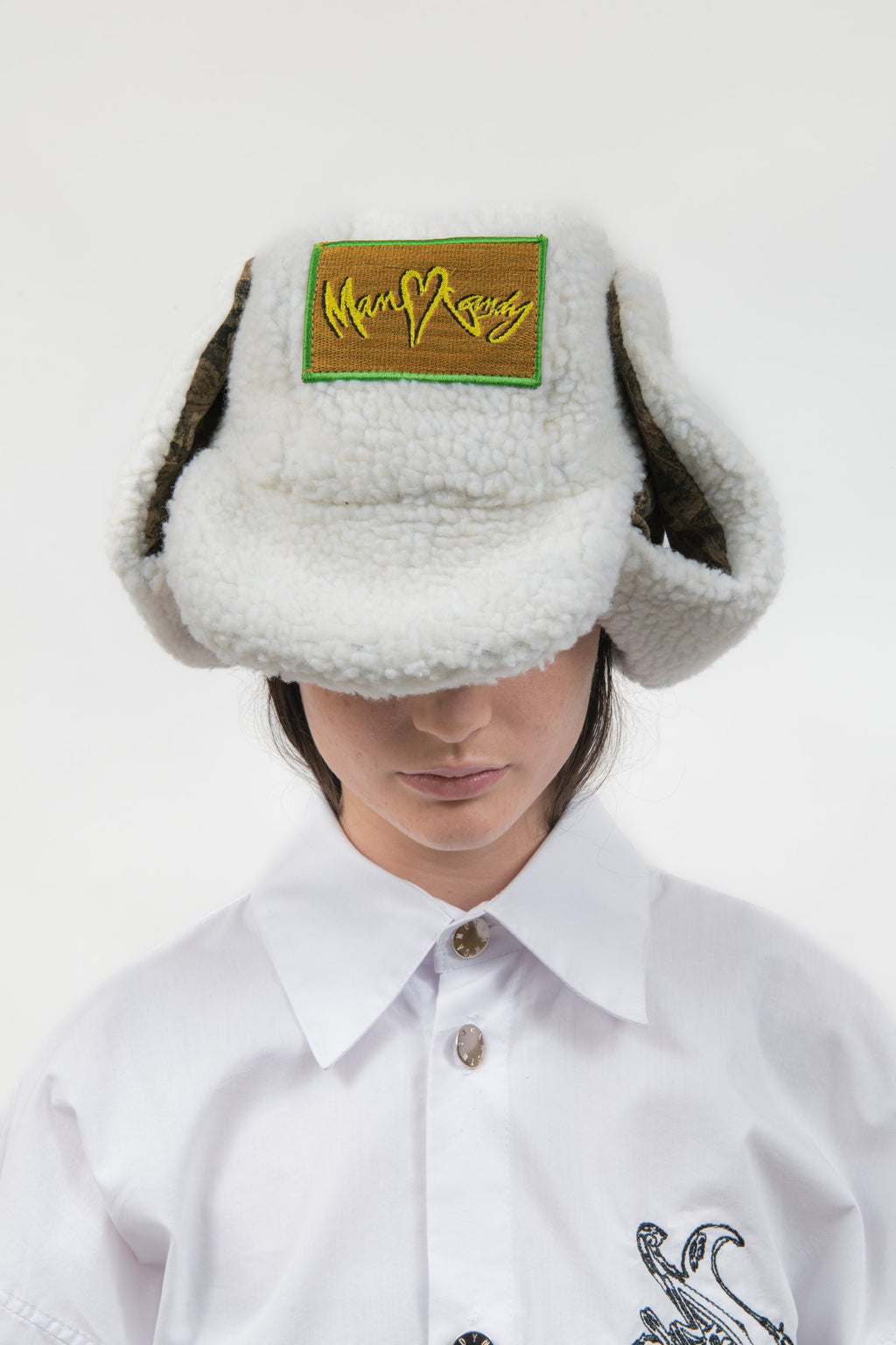 Close front detail of the Off Duty Hat with embroidered MANCANDY patch