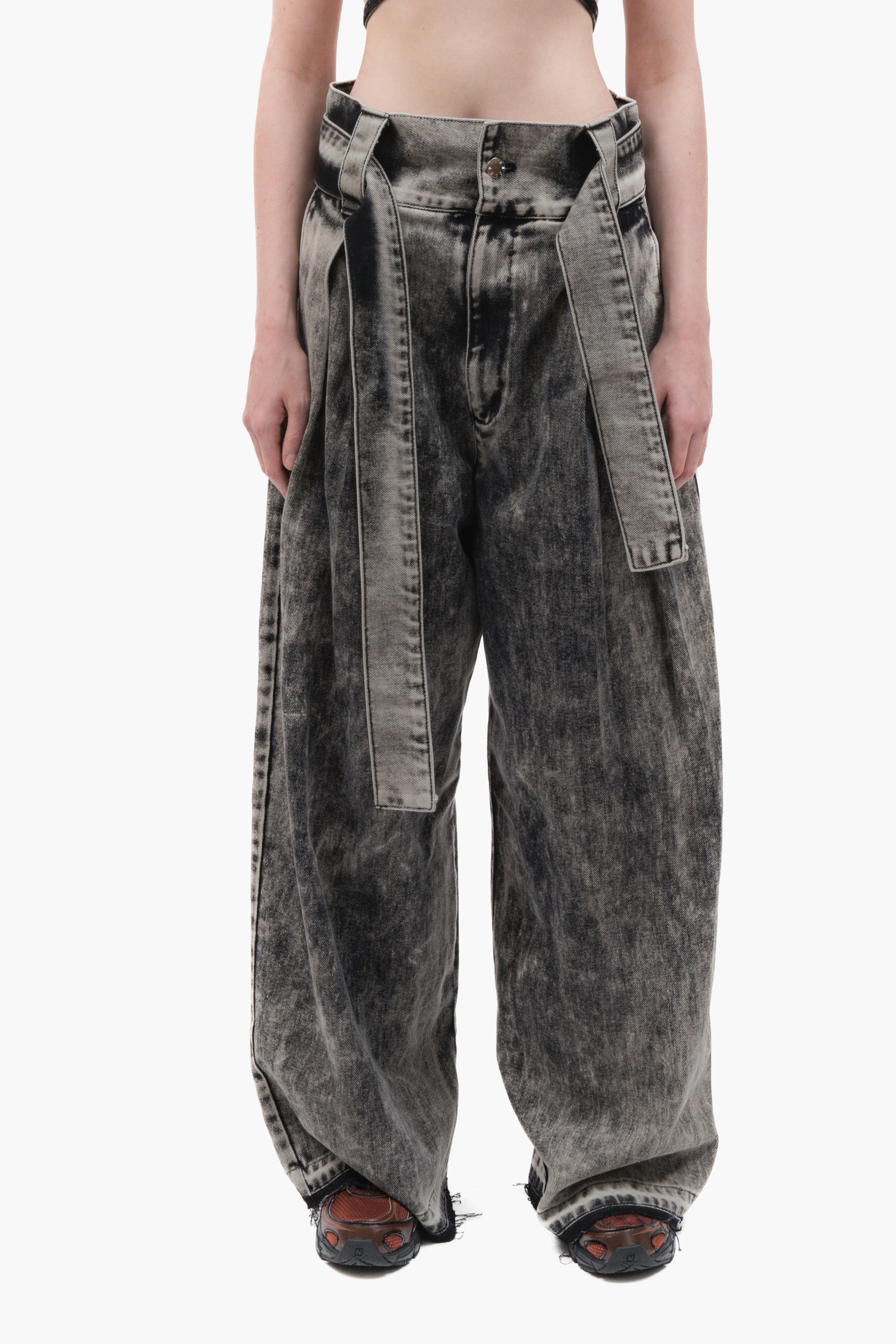 MANCANDY Ashes Wide Jeans in black acid-wash denim featuring an integrated belt, front pleats, oversized wide-leg silhouette and ash grey fading.