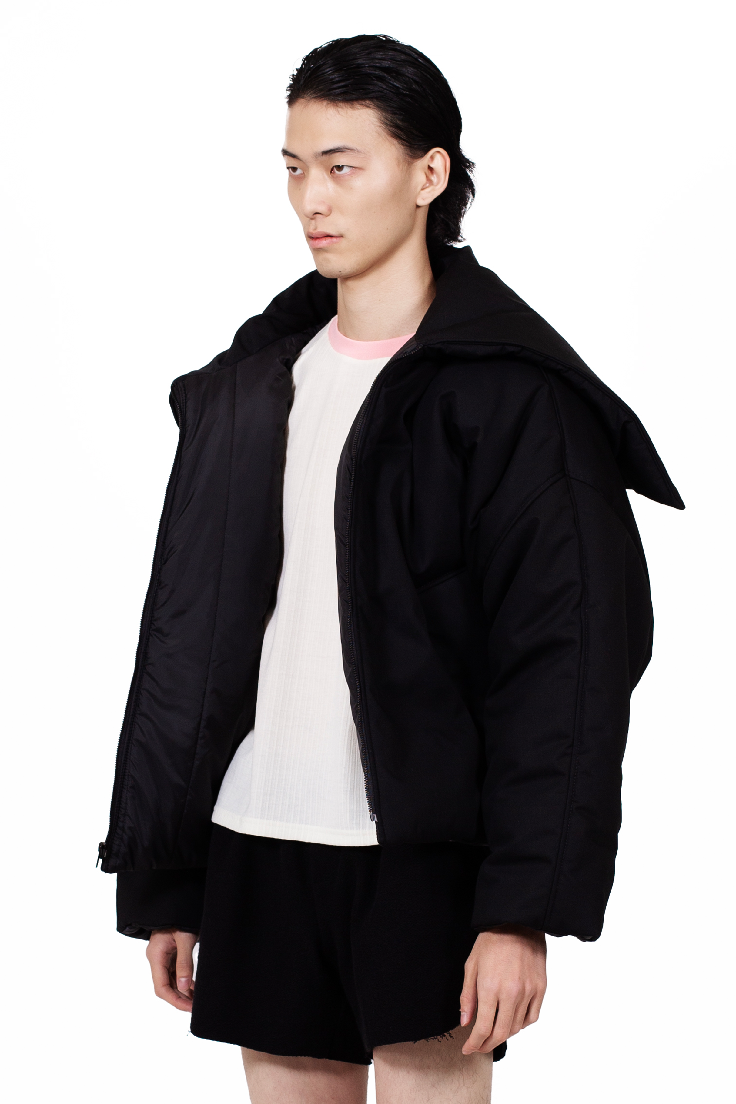 Black Nevado Puffer Jacket with oversized padded construction and metal zip closure.
