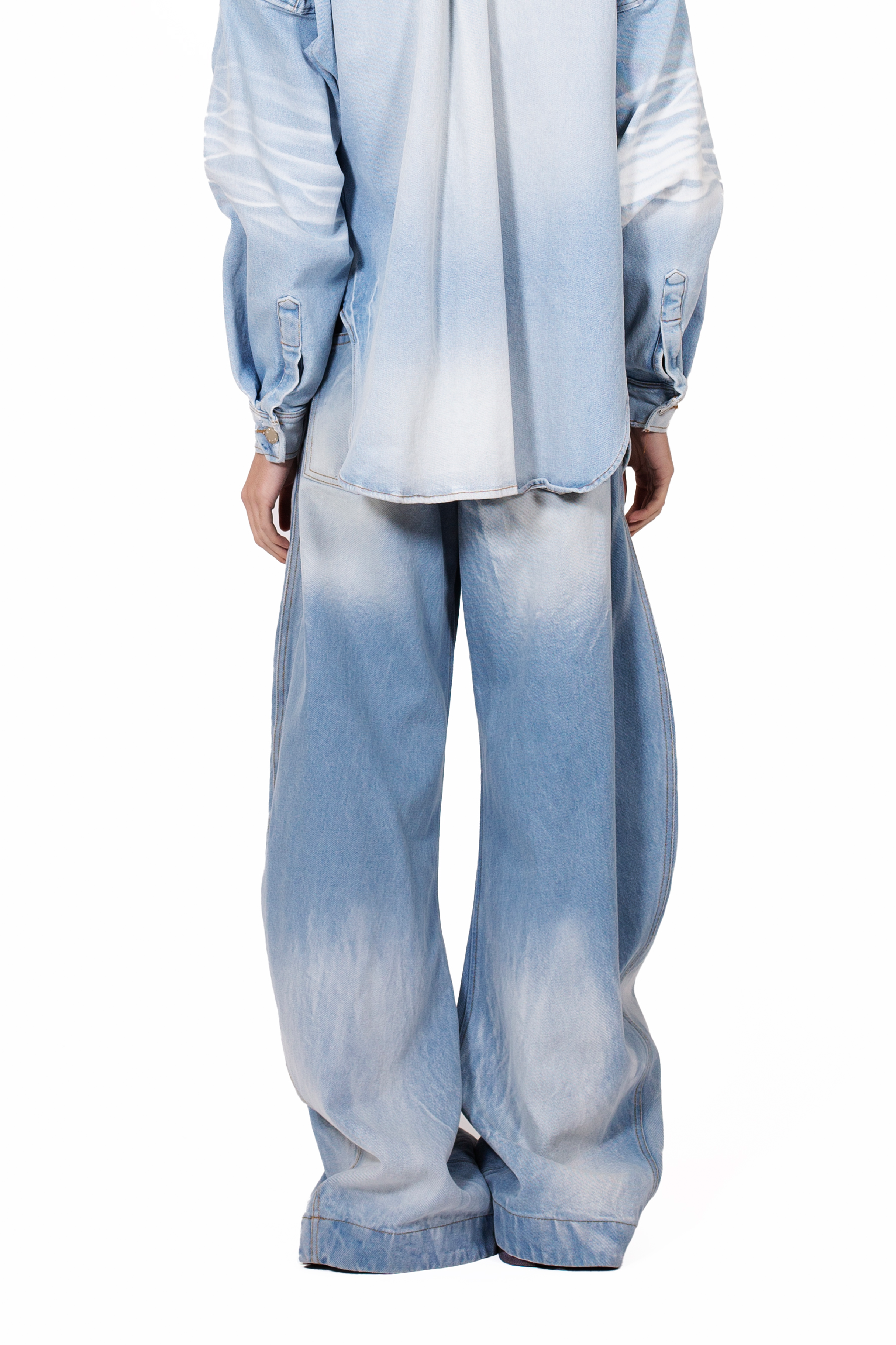 Rodeo Jeans Blue in heavyweight light blue cotton denim with five-pocket construction and front button opening detail.