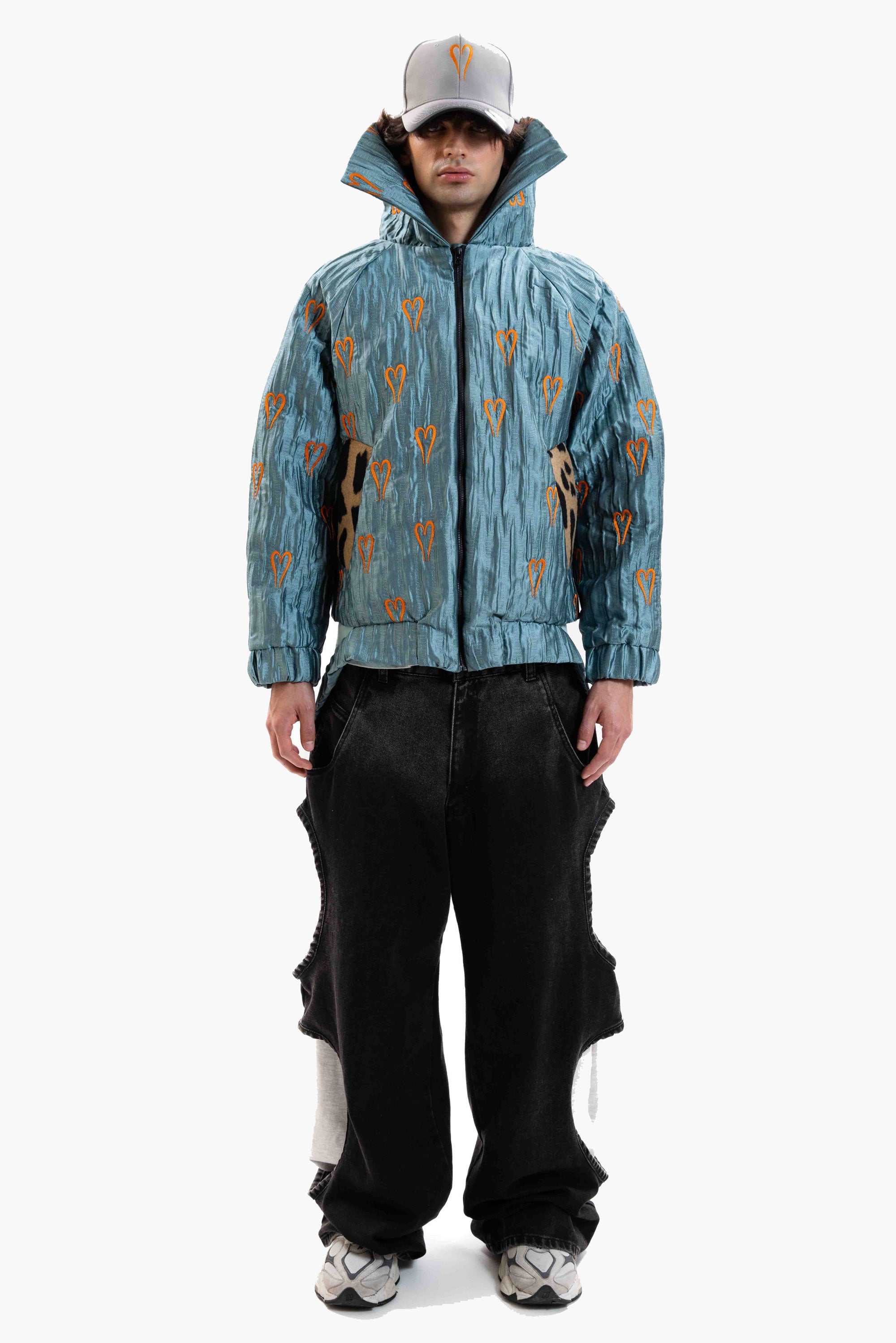Hearts Bomber Jacket in textured blue steel fabric with all-over heart embroidery and oversized silhouette.