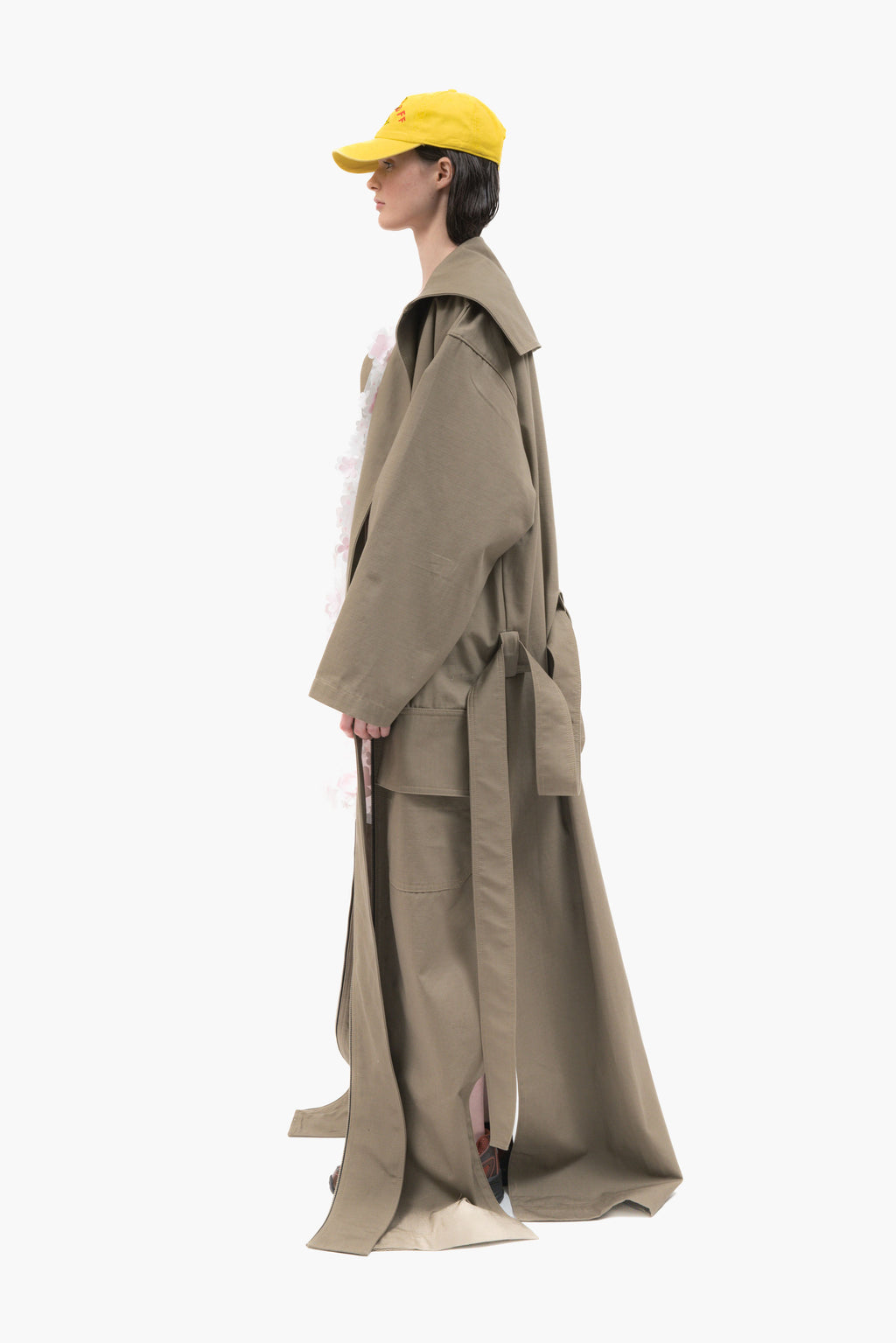 MANCANDY Dust Trench in khaki ripstop featuring an extra-long silhouette, oversized collar, utility pockets and trailing straps.