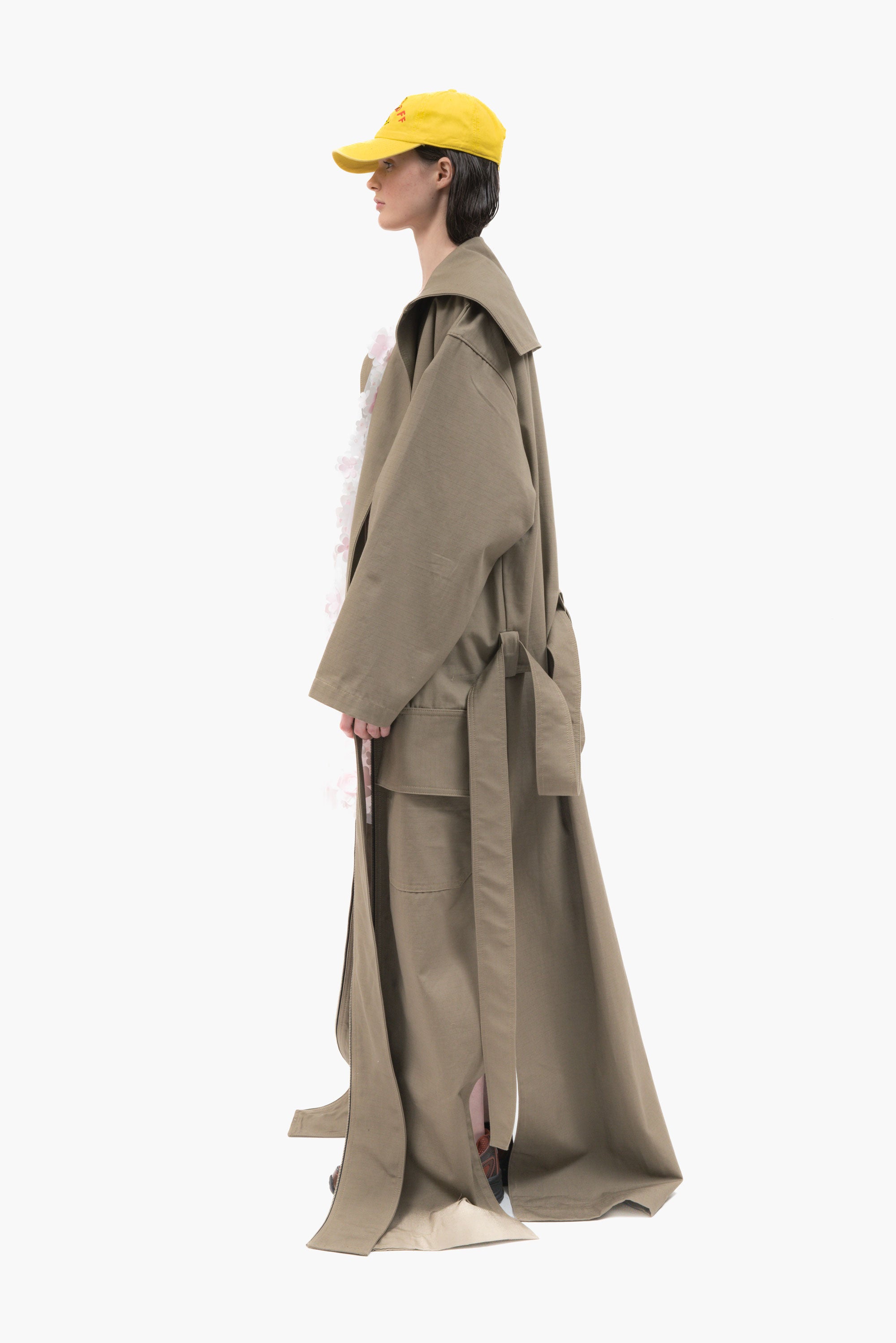 MANCANDY Dust Trench in khaki ripstop featuring an extra-long silhouette, oversized collar, utility pockets and trailing straps.