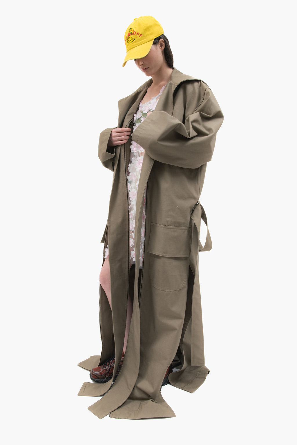 MANCANDY Dust Trench in khaki ripstop featuring an extra-long silhouette, oversized collar, utility pockets and trailing straps.