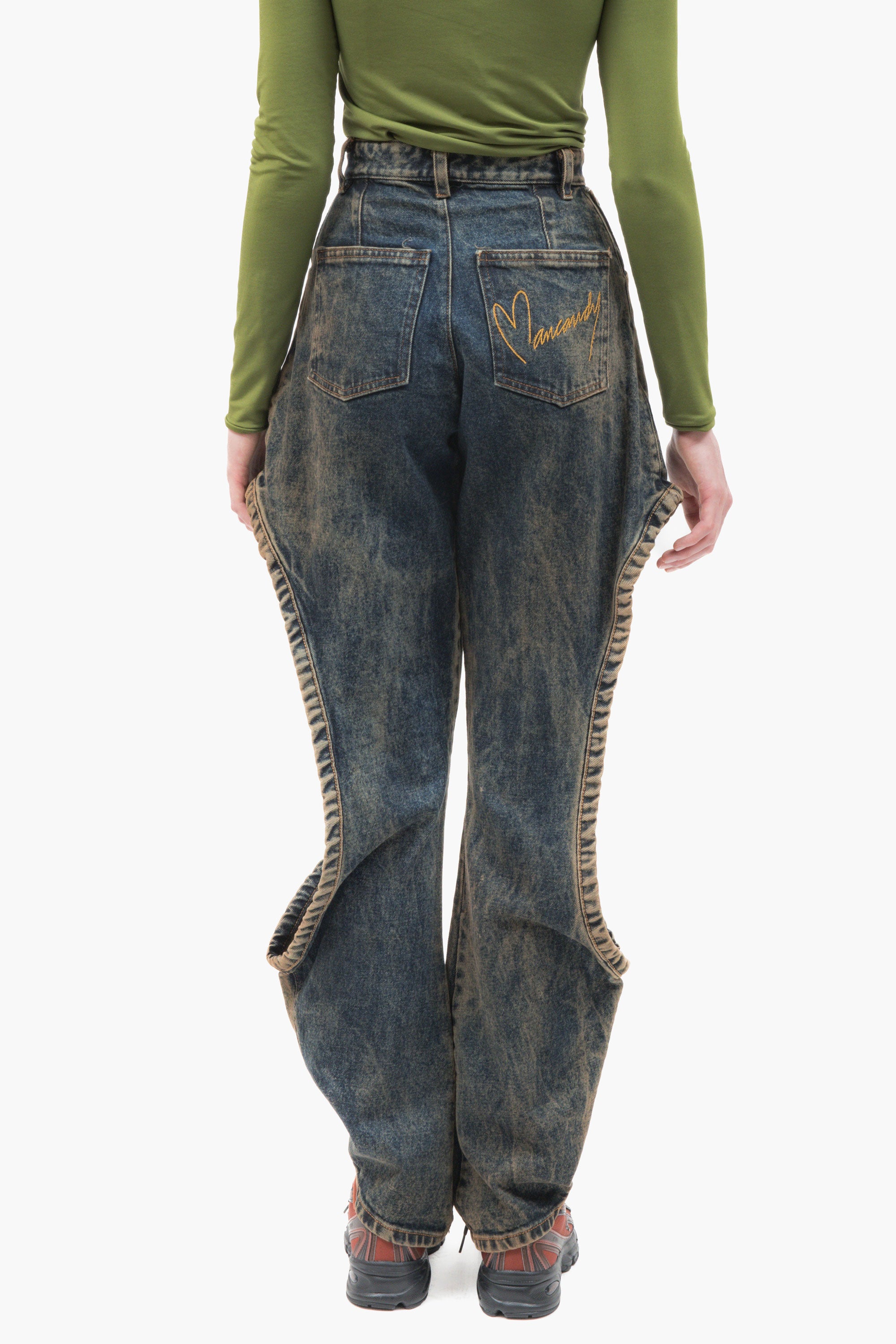 MANCANDY One Bite Jeans Dusty Blue in 100% cotton denim featuring a signature side cut-out, sculpted front pleat detail and embroidered back pocket logo.