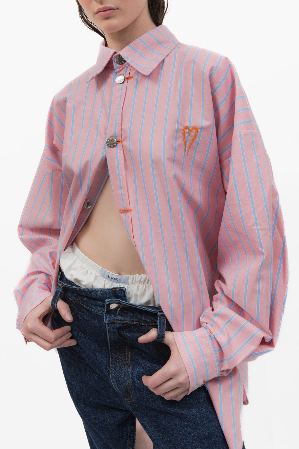 MANCANDY Monday Shirt in pink striped cotton featuring an oversized fit and orange Bladed Heart embroidery on the chest.