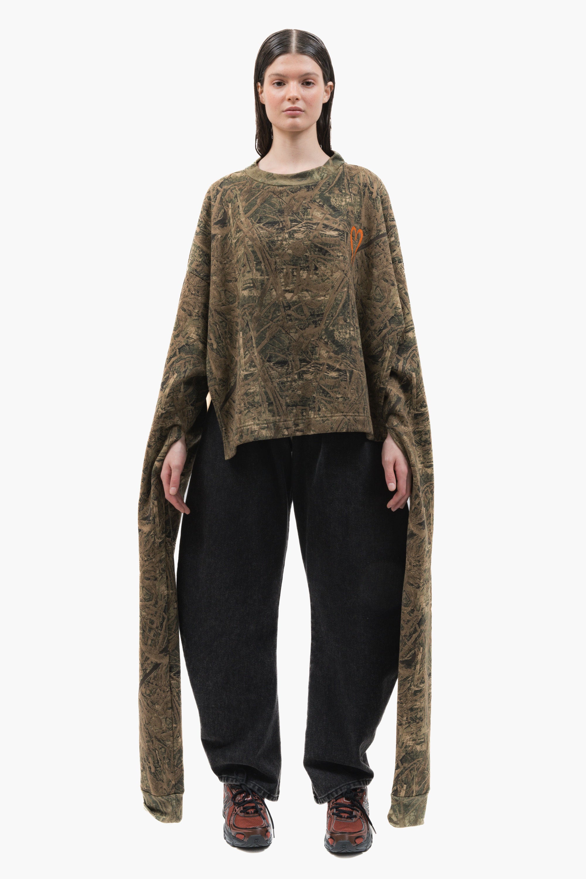 MANCANDY Poncho Sweatshirt Camo featuring camouflage print, embroidered heart logo, extra-long sleeves and open-sided poncho construction.