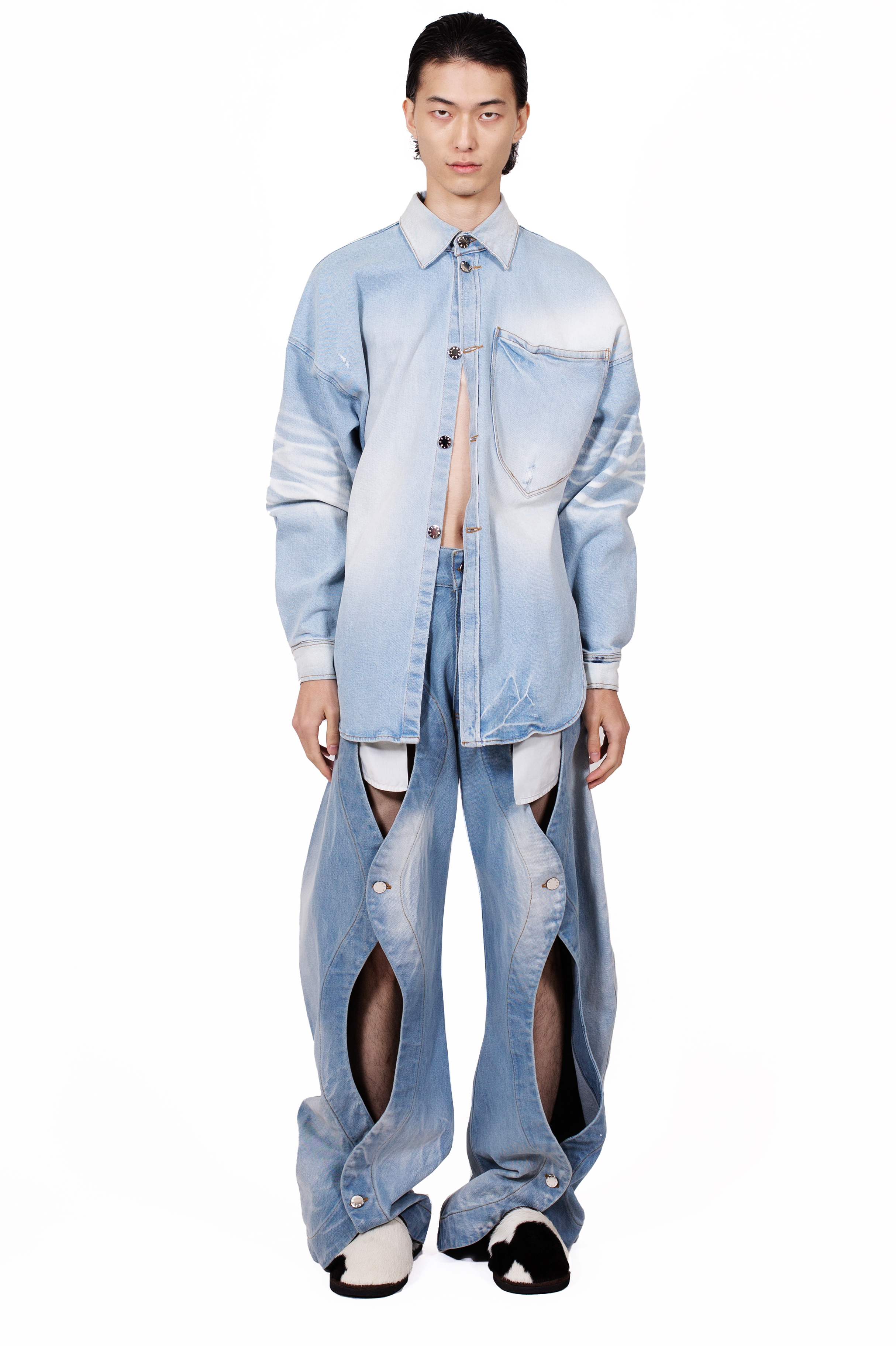 Rodeo Jeans Blue in heavyweight light blue cotton denim with five-pocket construction and front button opening detail.