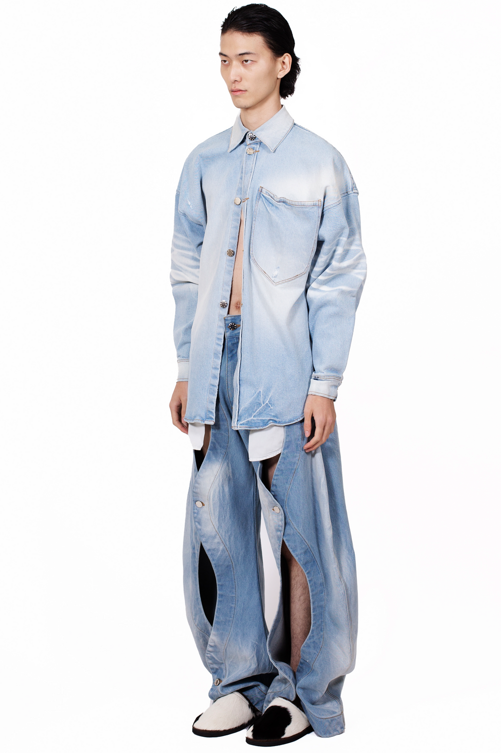 Rodeo Jeans Blue in heavyweight light blue cotton denim with five-pocket construction and front button opening detail.