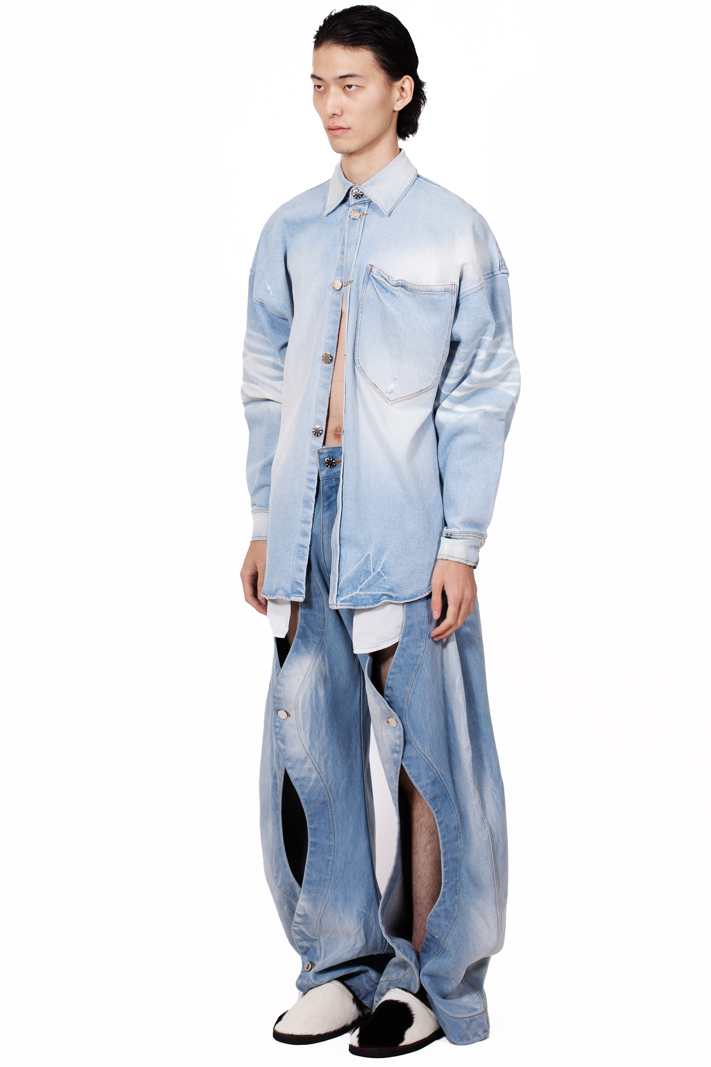 Rodeo Jeans Blue in heavyweight light blue cotton denim with five-pocket construction and front button opening detail.