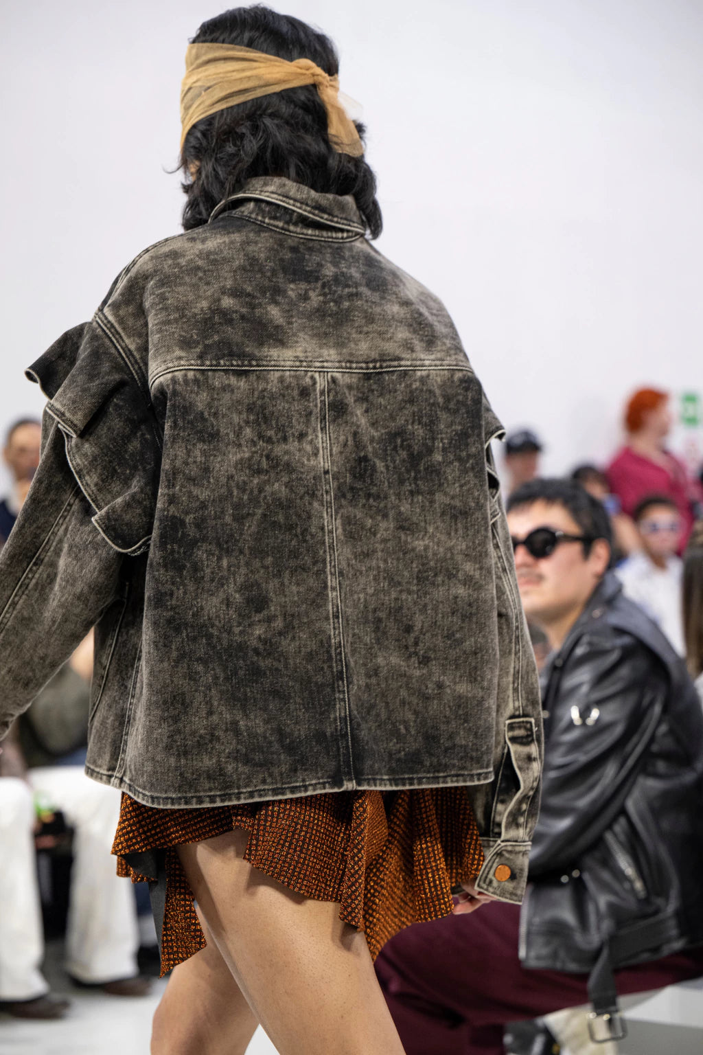 Oversized acid wash denim overshirt by MANCANDY featuring a sculptural western ruffle yoke, patch pockets, contrast stitching and metal jean buttons.