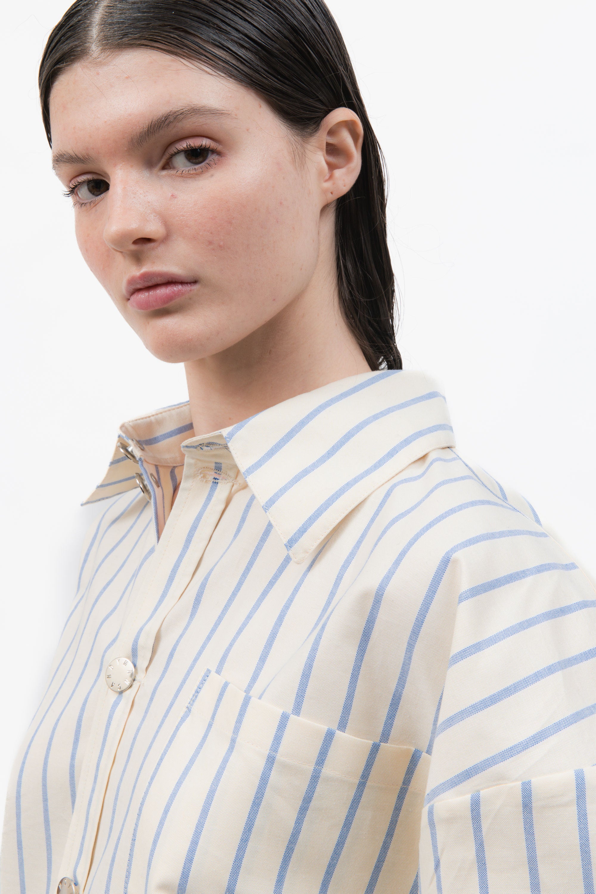A classic office shirt seen through the lens of MANCANDY. Cut in crisp striped cotton with an oversized silhouette.