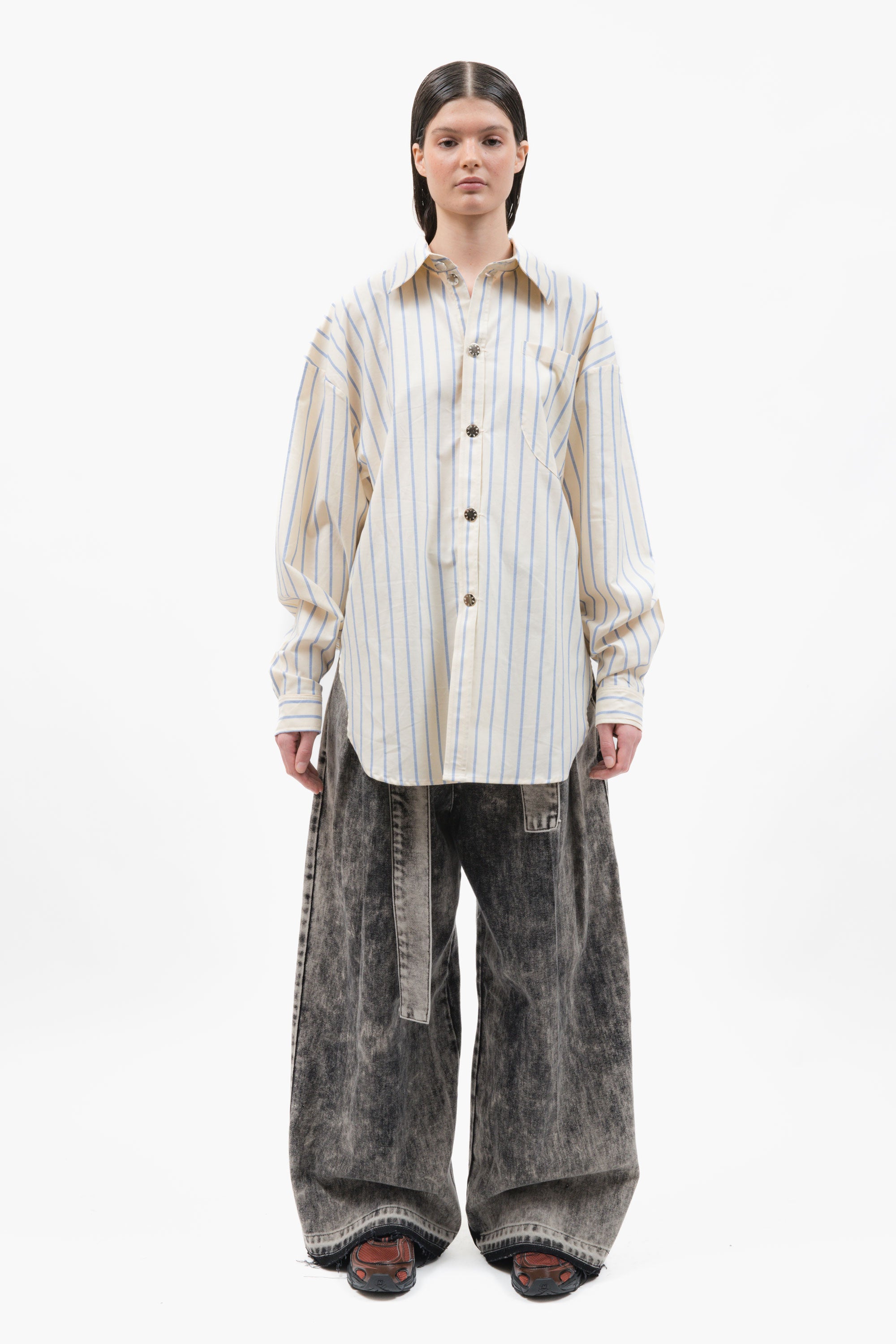 A classic office shirt seen through the lens of MANCANDY. Cut in crisp striped cotton with an oversized silhouette.