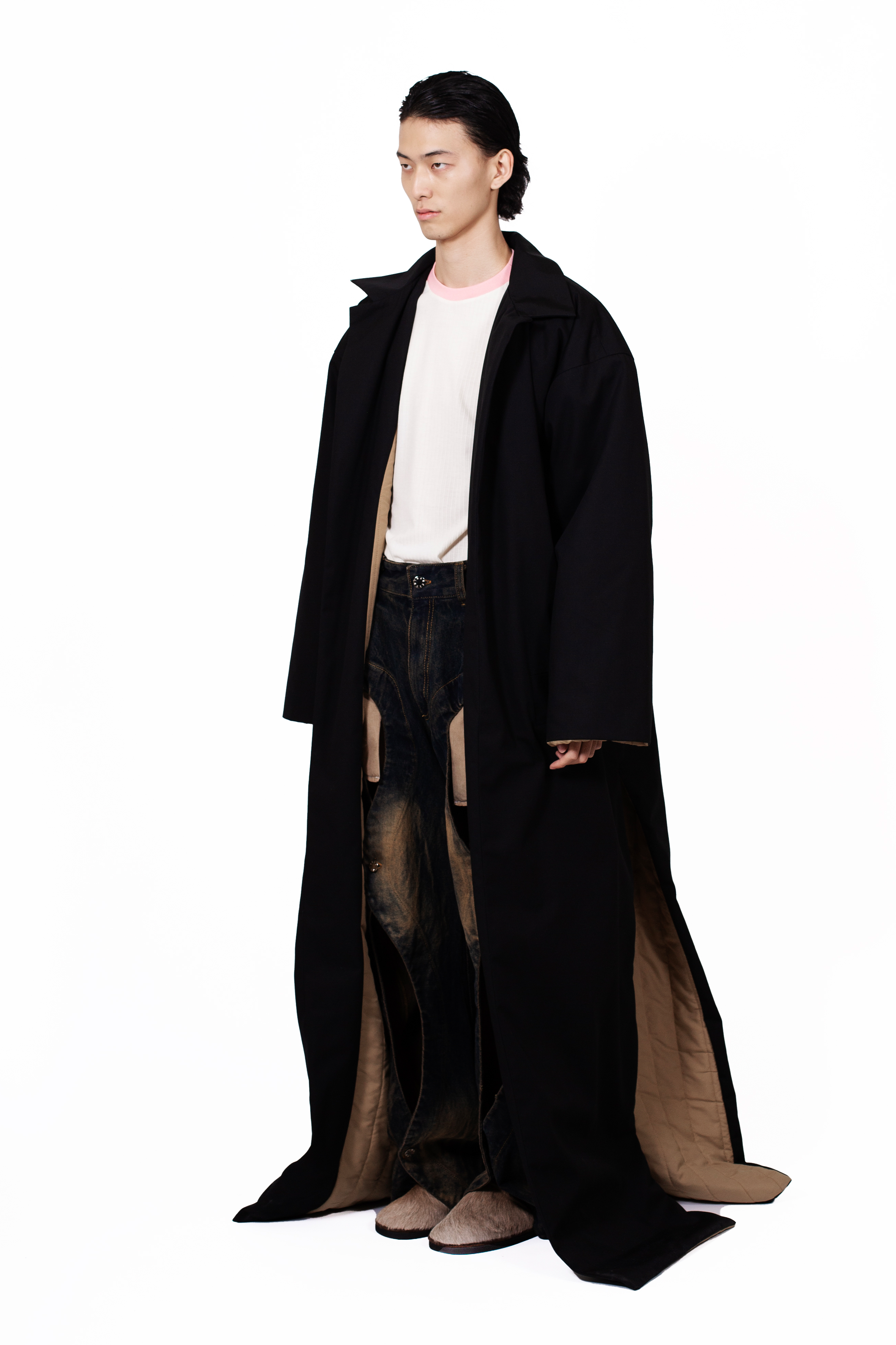 Vampire Coat in cotton gabardine with quilted lining, extra-long silhouette and side slits.