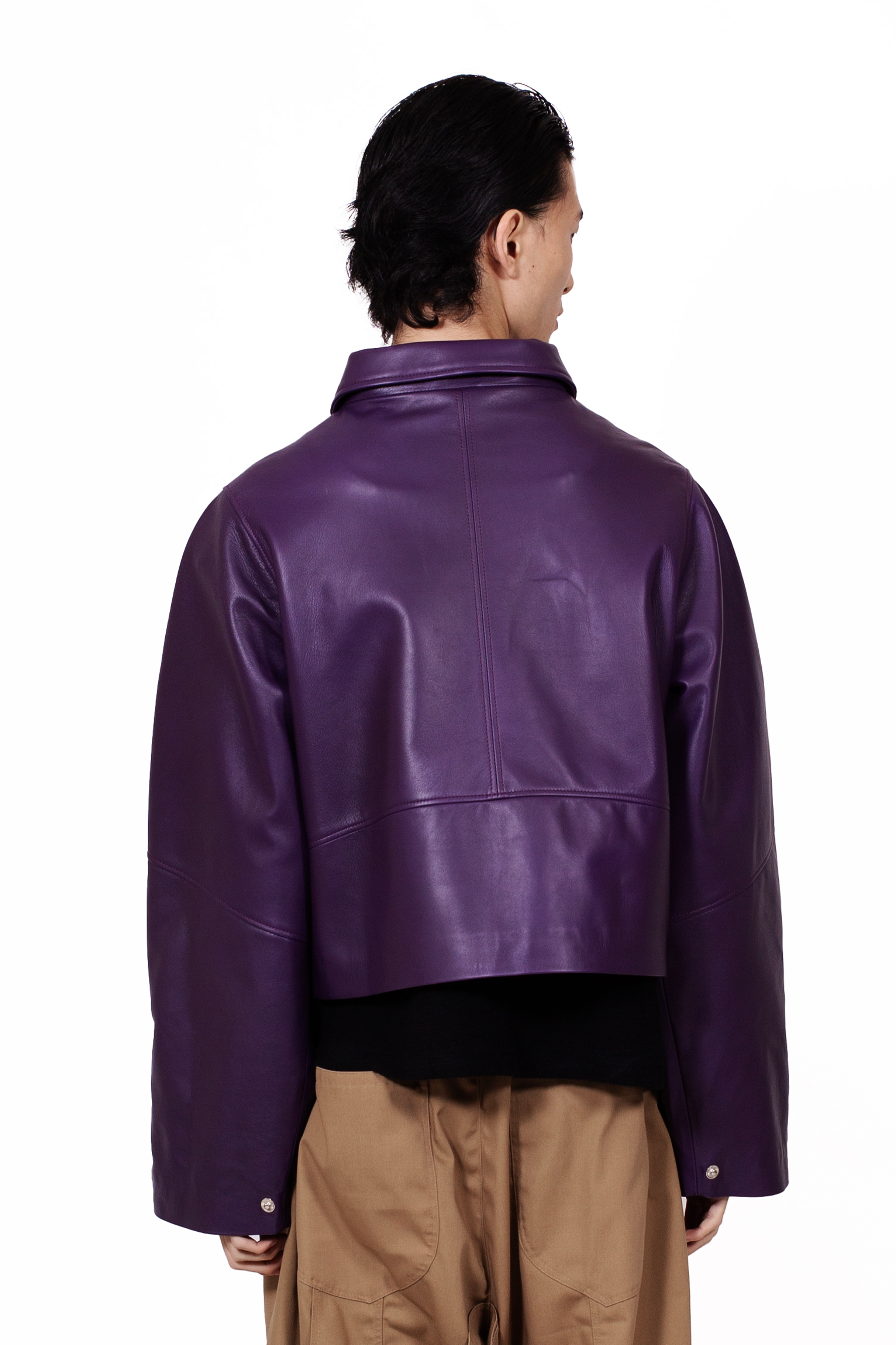 MANCANDY Racer Leather Jacket featuring a cropped oversized silhouette, open collar, black metal hardware, sleeve zip pocket and utility-inspired detailing.